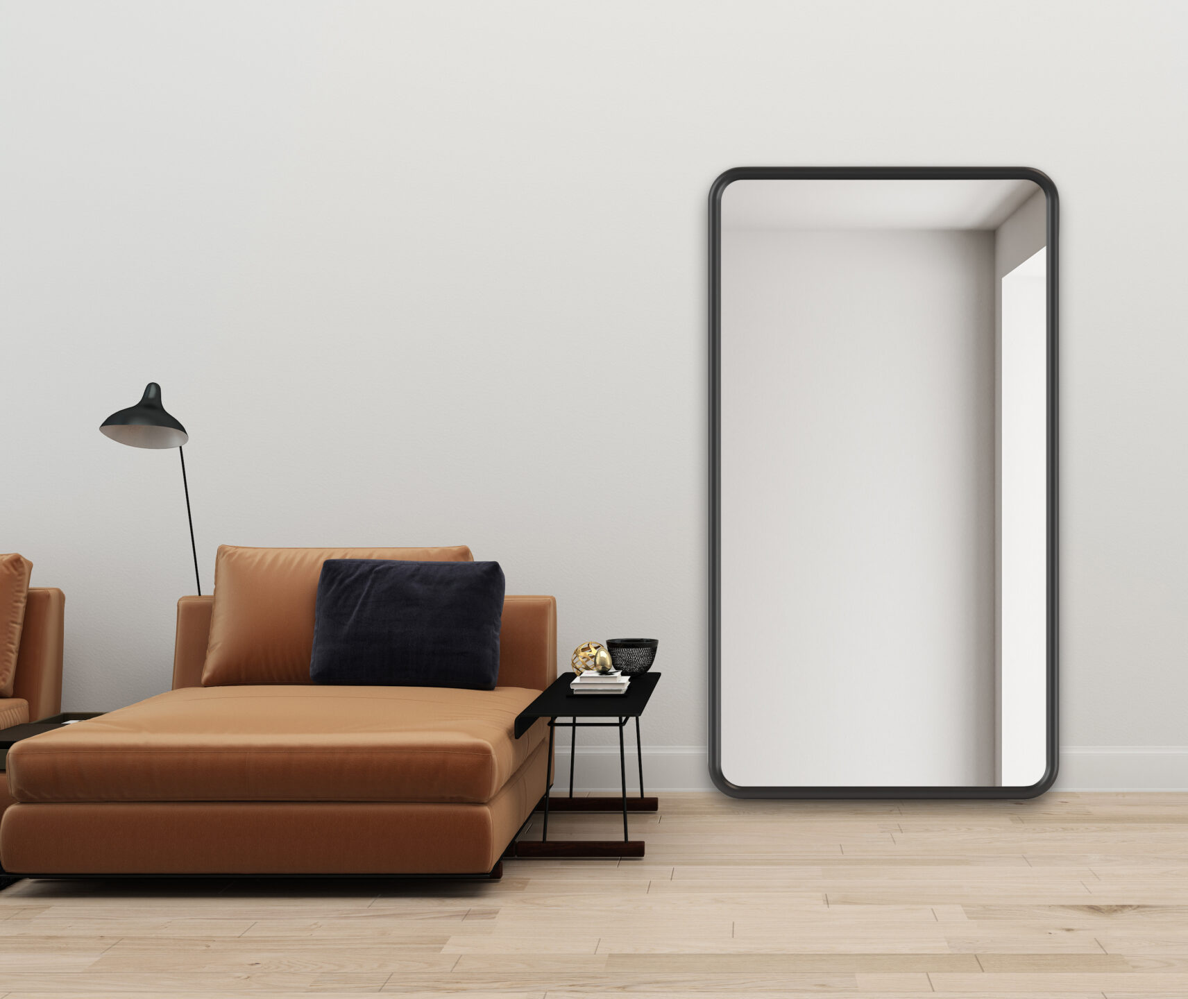 lustro z czarną ramę oparte o ścianę
