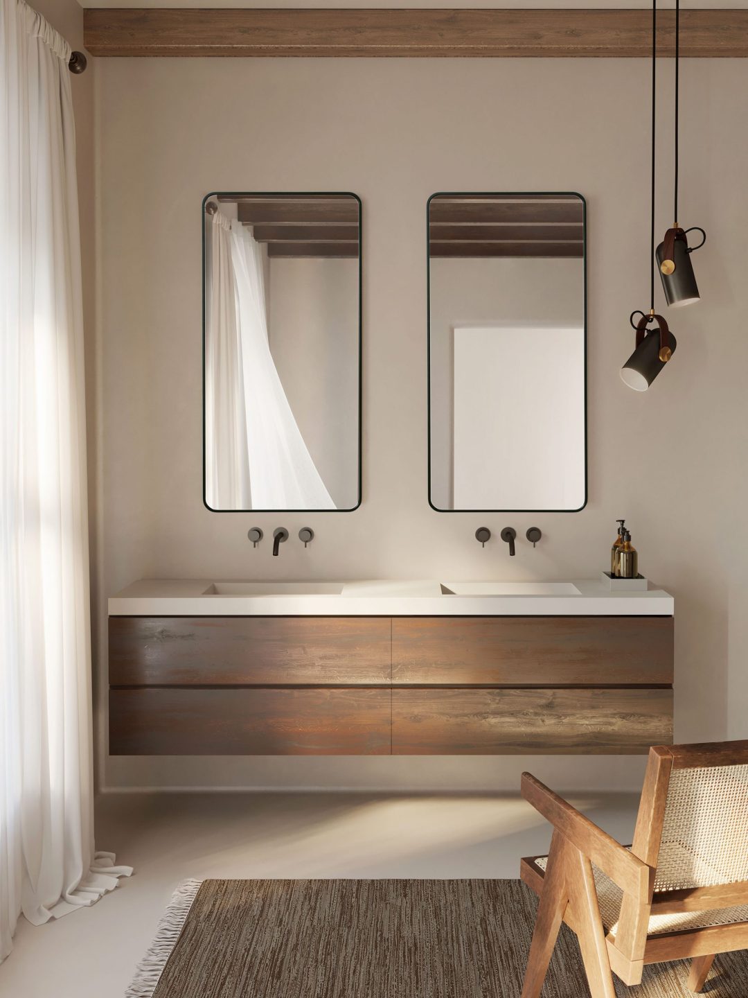 dwa lustra w czarnej ramie nad umywalką