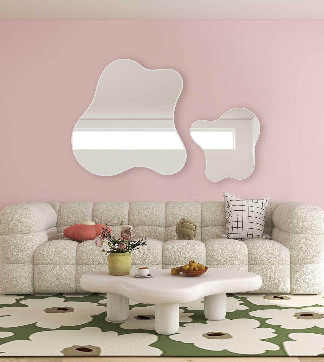 dwa lustra organiczne marshmallow w ksztalcie pianki cukrowej w salonie nad kremowa sofa na jasnorozowej scianie