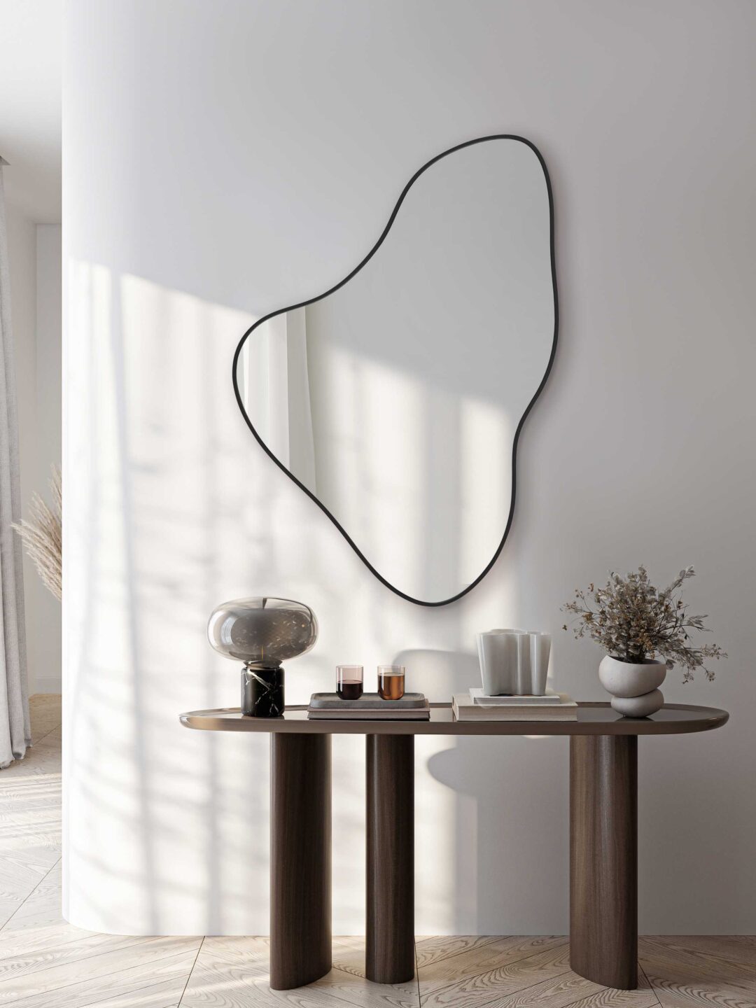 lustro organiczne twitter w czarnej ramie nad orzechowa konsola